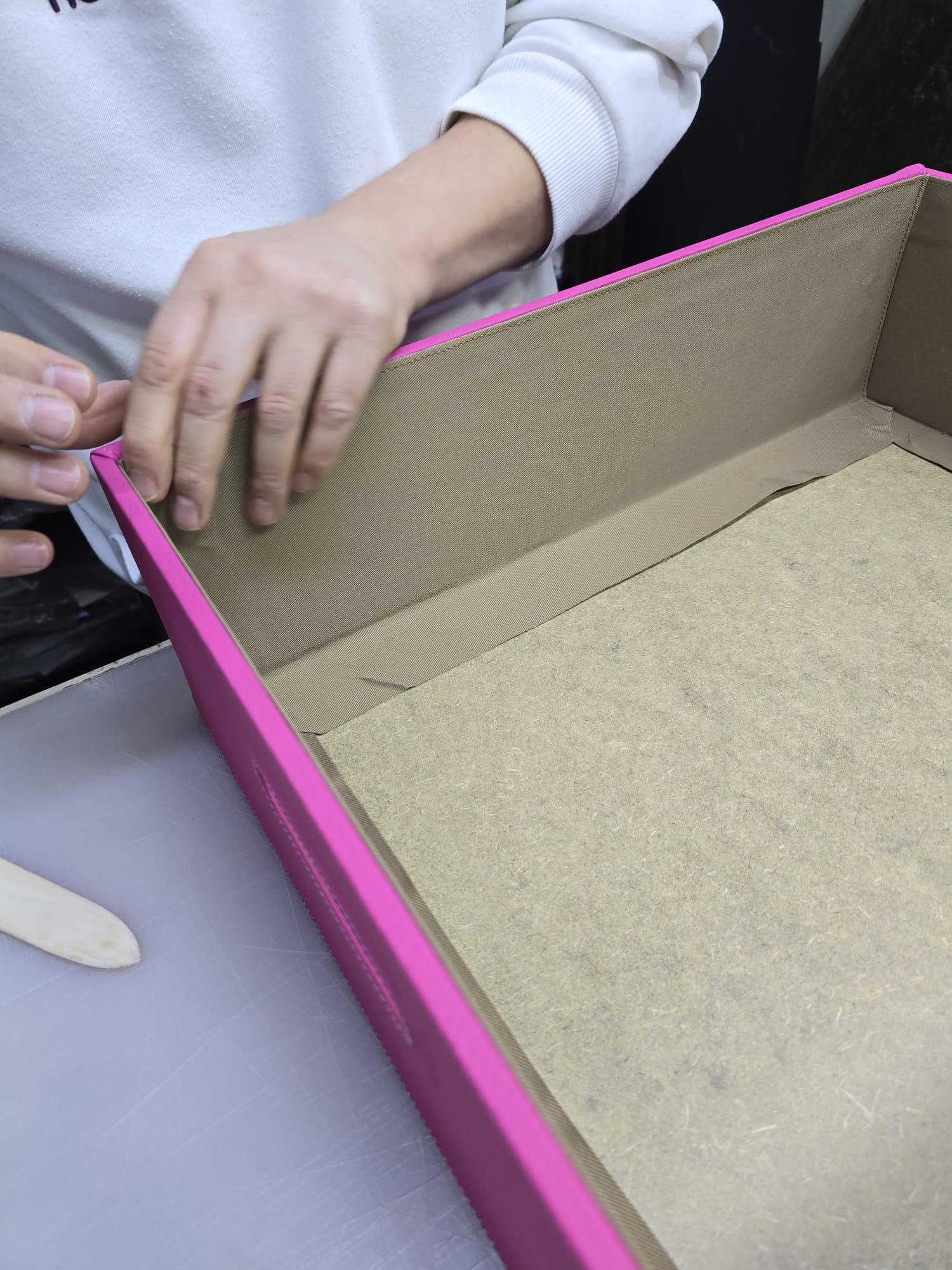 Handcrafted leather laundry box construction detail