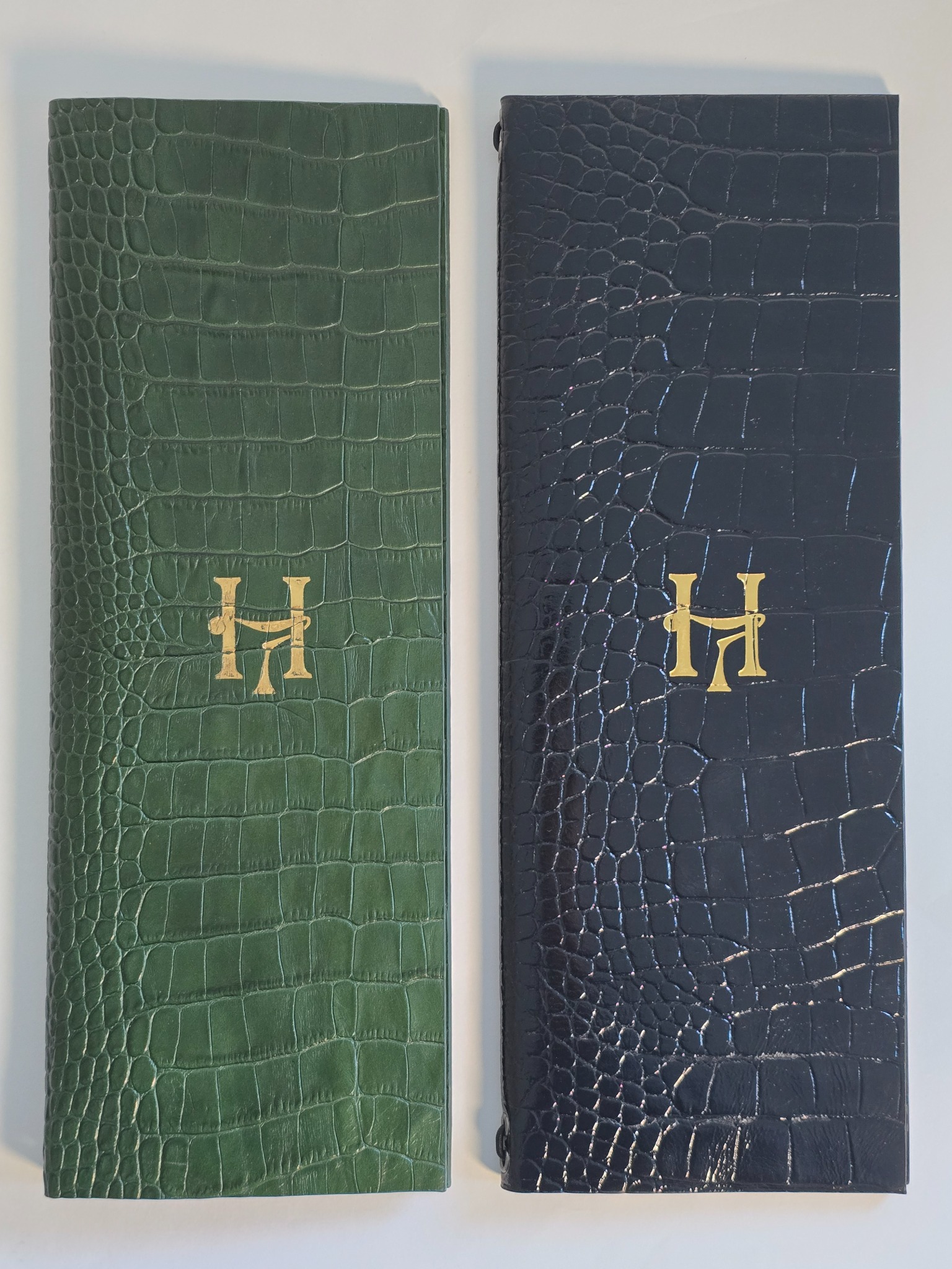 Pair of crocodile embossed leather menu covers for Louie Covent Garden