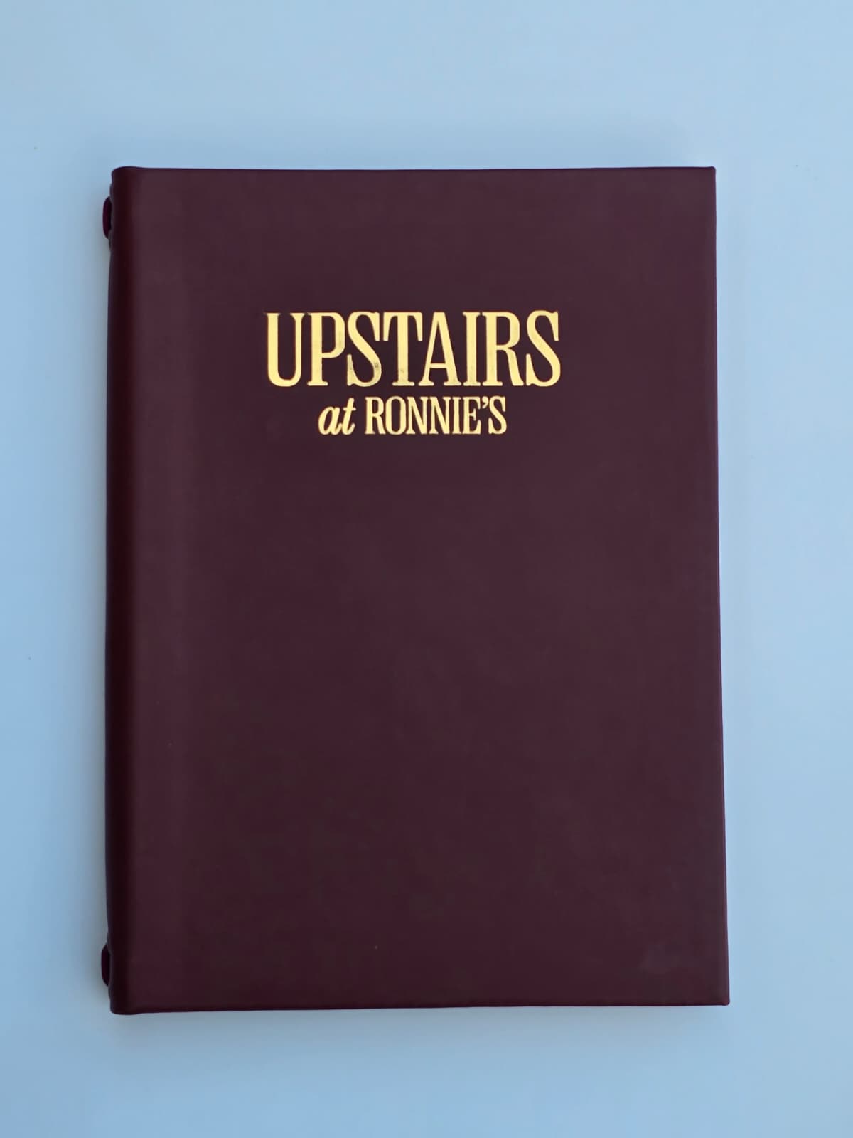Luxury leather menu cover for Upstairs at Ronnie's inside Ronnie Scott's Soho